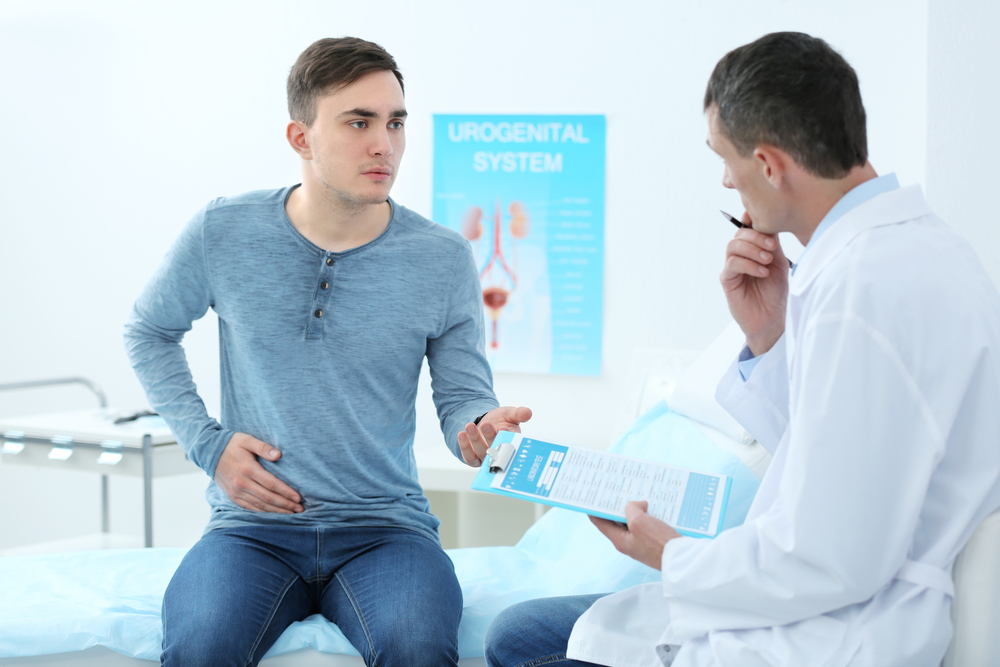 male patient discussing health issues with doctor.
