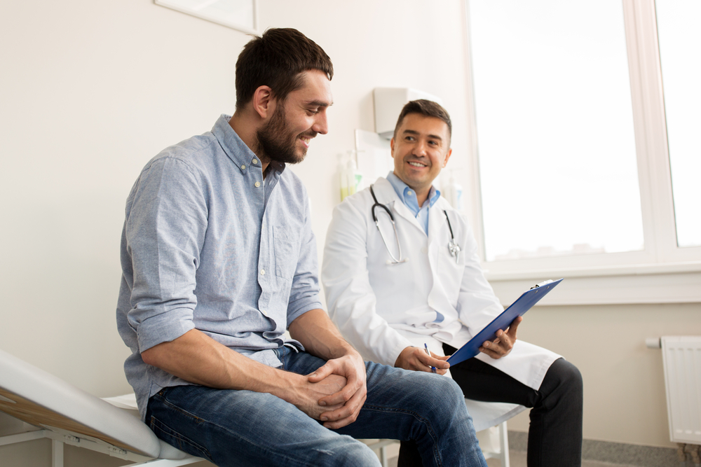 patient talking to urologist about blood in urine.