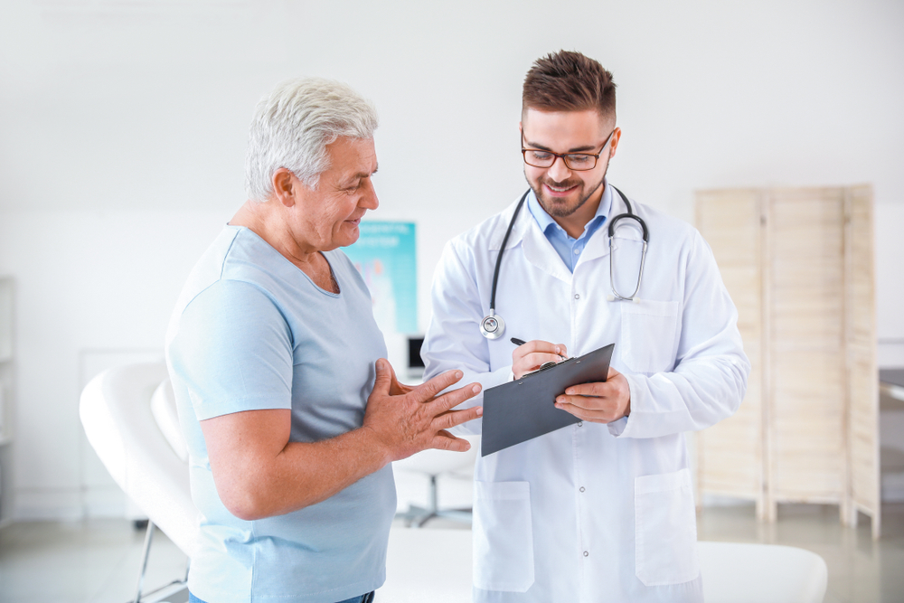 man talking to a urologist.