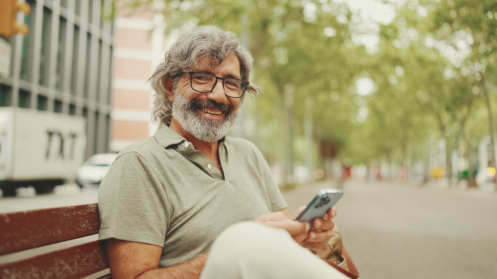 older man smiling.